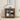 Wooden side table with decorative items in a living room setting