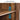 Wooden shelf with 3-height adjustable feature and acrylic clear door with arched lines.