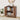 Wooden cabinet with open doors displaying various items in a room setting.