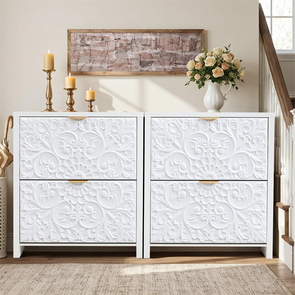 White dresser with decorative embossed design in a room with a staircase and wall art.