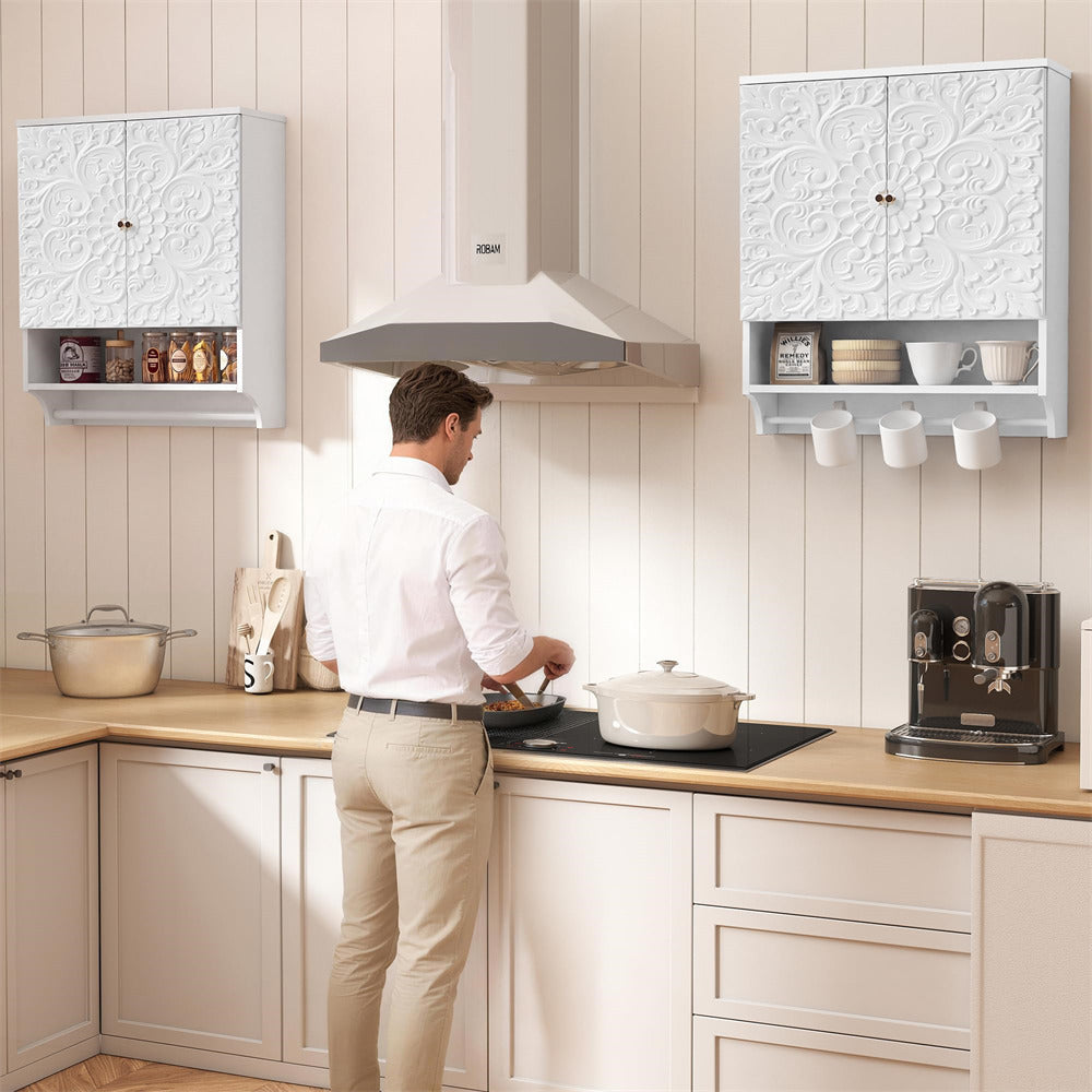 Man cooking in a modern kitchen with light-colored cabinets and appliances.