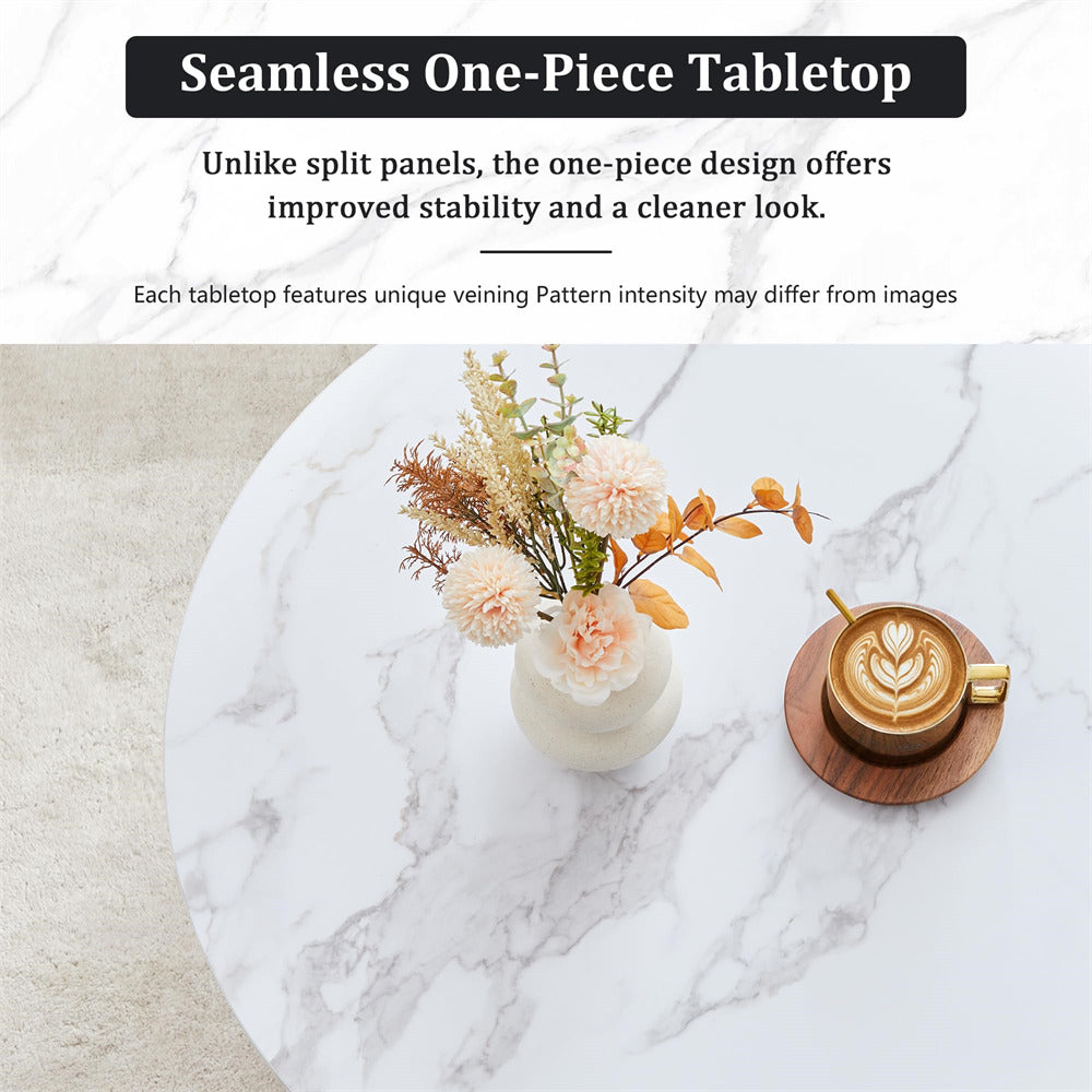 Round marble table with a vase of flowers and a coffee cup on a white marble surface.