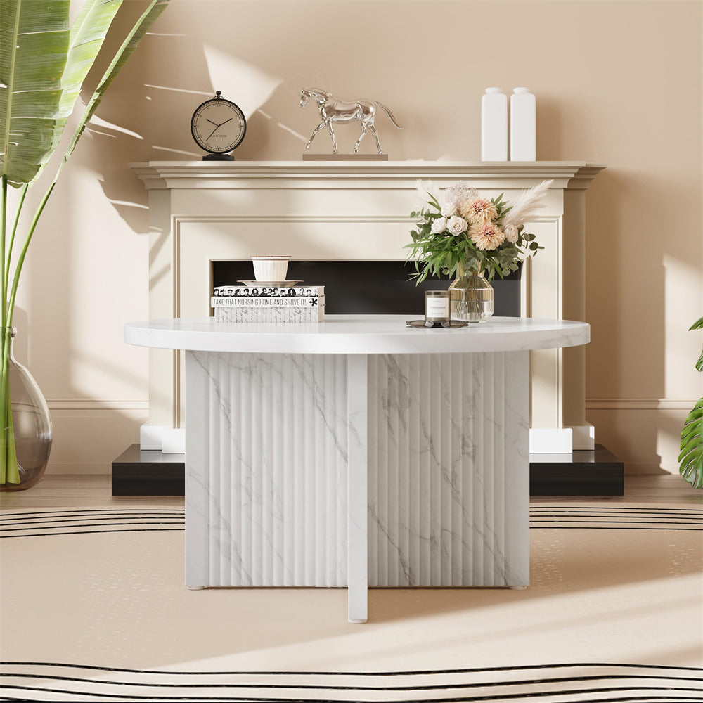 Modern white console table with decorative items against a beige wall.