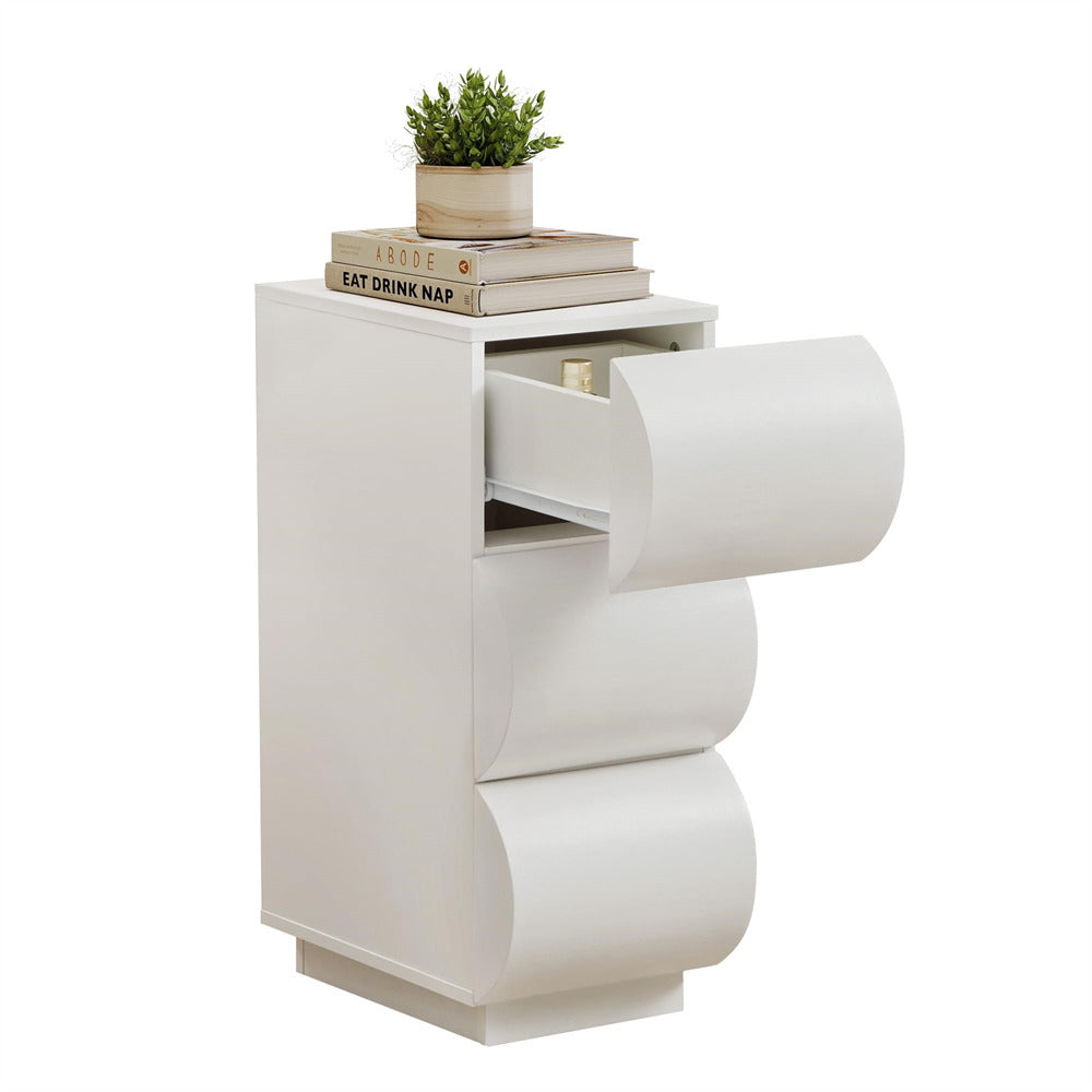 White side table with a drawer and decorative items on top against a white background
