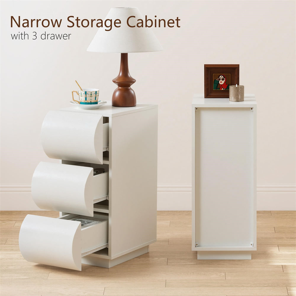 Narrow storage cabinet with three drawers in a room setting.