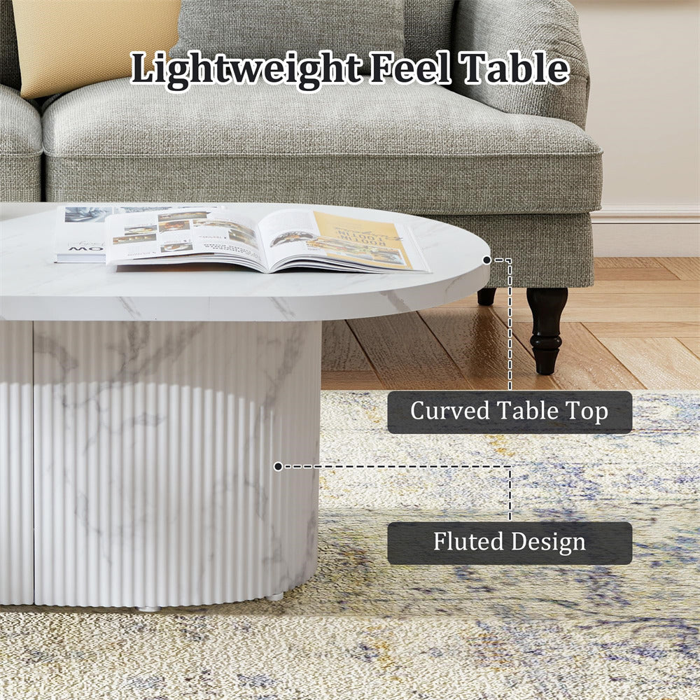 Lightweight feel table with curved top and fluted design in a living room setting.