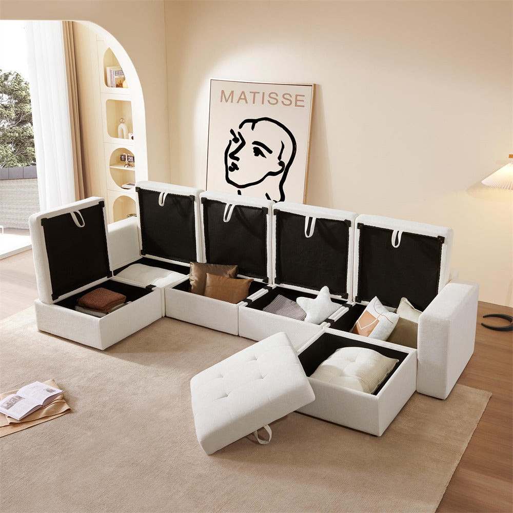 White sectional sofa with storage compartments in a living room setting.