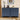Blue dresser with four drawers in a room setting with decor items.