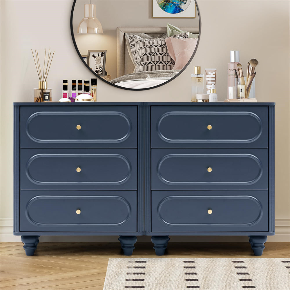 Blue dresser with decorative items in a bedroom setting